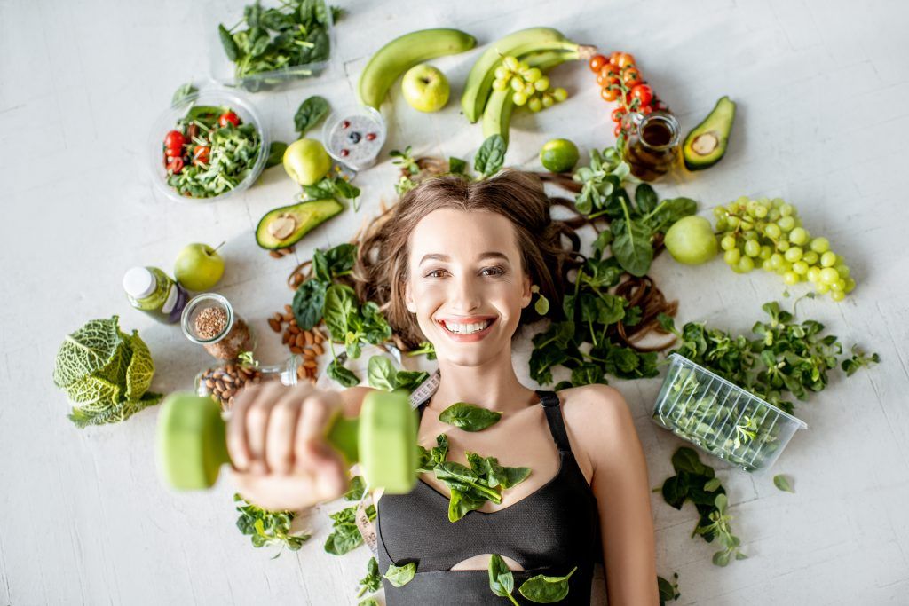 Portrait Of A Sports Woman With Healthy Food